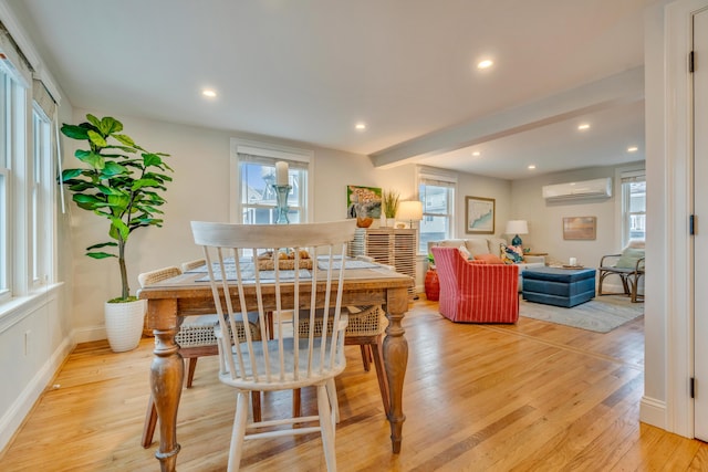 4 Union Ave, Old Orchard Beach, ME 04064 - dining area featuring an AC wall unit, plenty of natural light, light wood-style floors, recessed lighting, and baseboards