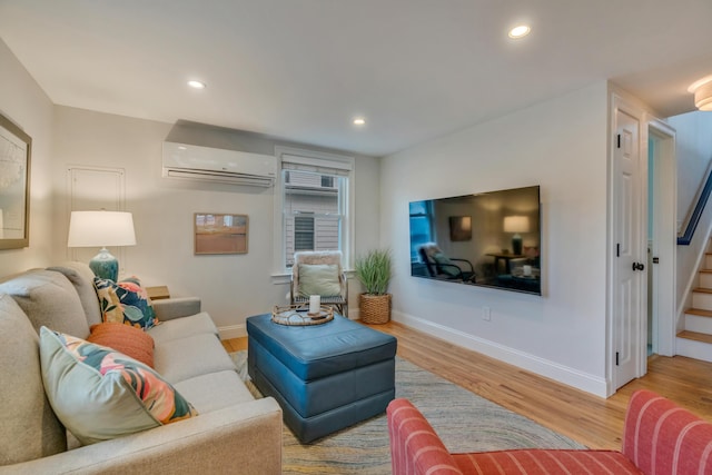 4 Union Ave, Old Orchard Beach, ME 04064 - living room featuring a wall mounted AC, wood finished floors, stairs, baseboards, and recessed lighting