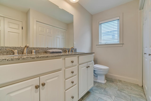 4 Union Ave, Old Orchard Beach, ME 04064 - full bathroom featuring double vanity, toilet, and baseboards