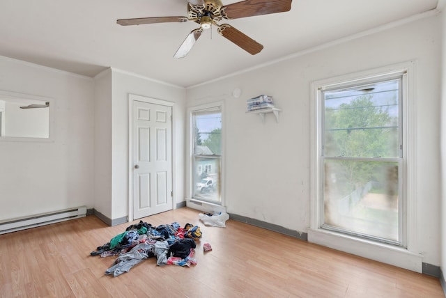 14 N St, Augusta, ME 04330 - unfurnished room featuring ornamental molding, healthy amount of natural light, wood finished floors, and a ceiling fan