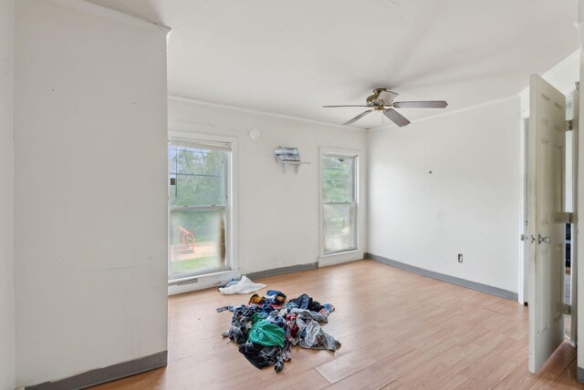 14 N St, Augusta, ME 04330 - unfurnished room featuring ceiling fan, light wood-style floors, crown molding, and baseboards