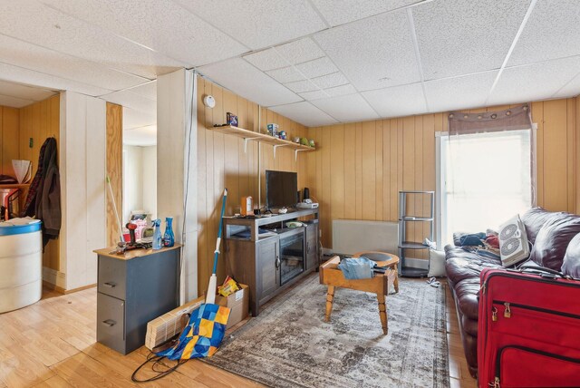 14 N St, Augusta, ME 04330 - living area with wood finished floors, wooden walls, and a drop ceiling