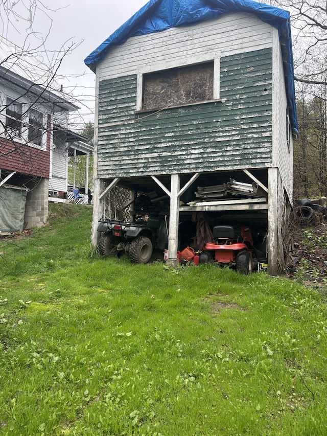 rear view of house featuring a lawn