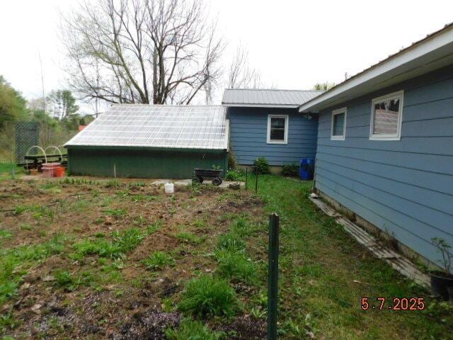 view of yard with an exterior structure and an outbuilding