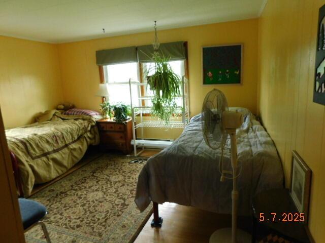 bedroom with wood finished floors