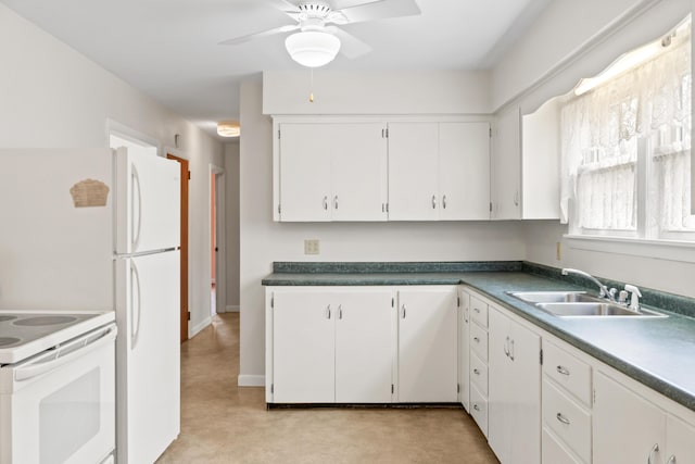kitchen with white appliances, ceiling fan, white cabinets, and a sink