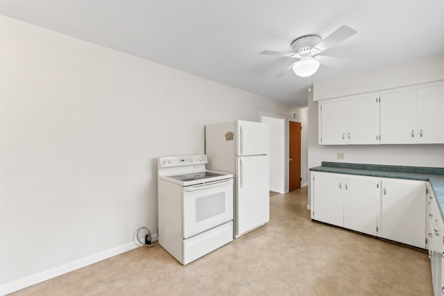 kitchen with white appliances, a ceiling fan, white cabinets, dark countertops, and baseboards