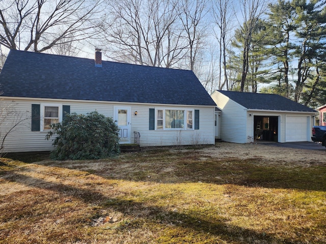 view of front of property with a chimney, entry steps, roof with shingles, and a garage