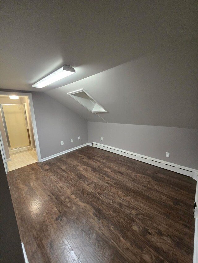 116 Center St, Van Buren, ME 04785 - additional living space featuring a skylight, baseboard heating, lofted ceiling, wood finished floors, and baseboards
