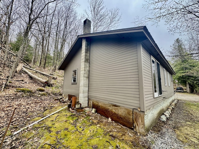 1429 Canada Rd, Moscow, ME 04920 - view of side of property with a chimney