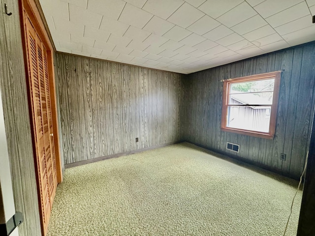 1429 Canada Rd, Moscow, ME 04920 - empty room featuring wooden walls and carpet