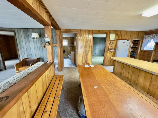 1429 Canada Rd, Moscow, ME 04920 - interior space featuring wooden walls and light carpet