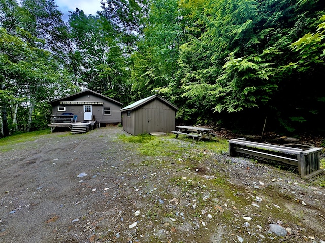 1429 Canada Rd, Moscow, ME 04920 - view of yard featuring a shed and a deck