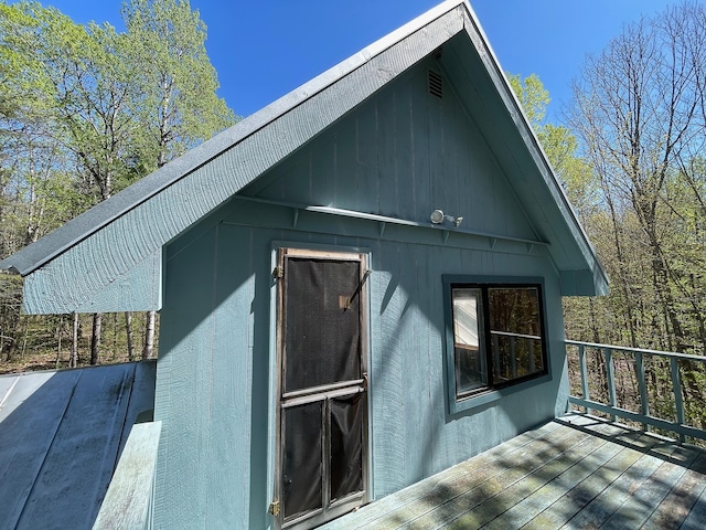 view of property exterior with a deck