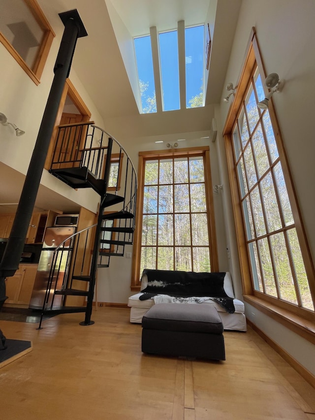 common area featuring a towering ceiling and stairs