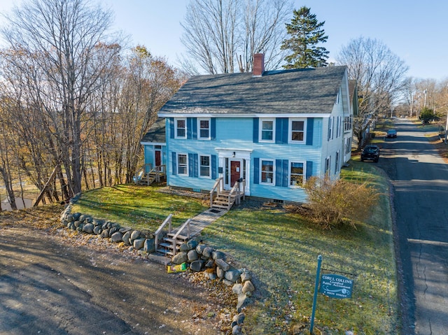 2 High St, Machias, ME 04654 - view of front of property featuring a chimney, roof with shingles, a front yard, and entry steps