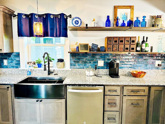 2 High St, Machias, ME 04654 - kitchen with dishwashing machine, a sink, open shelves, decorative backsplash, and light stone countertops