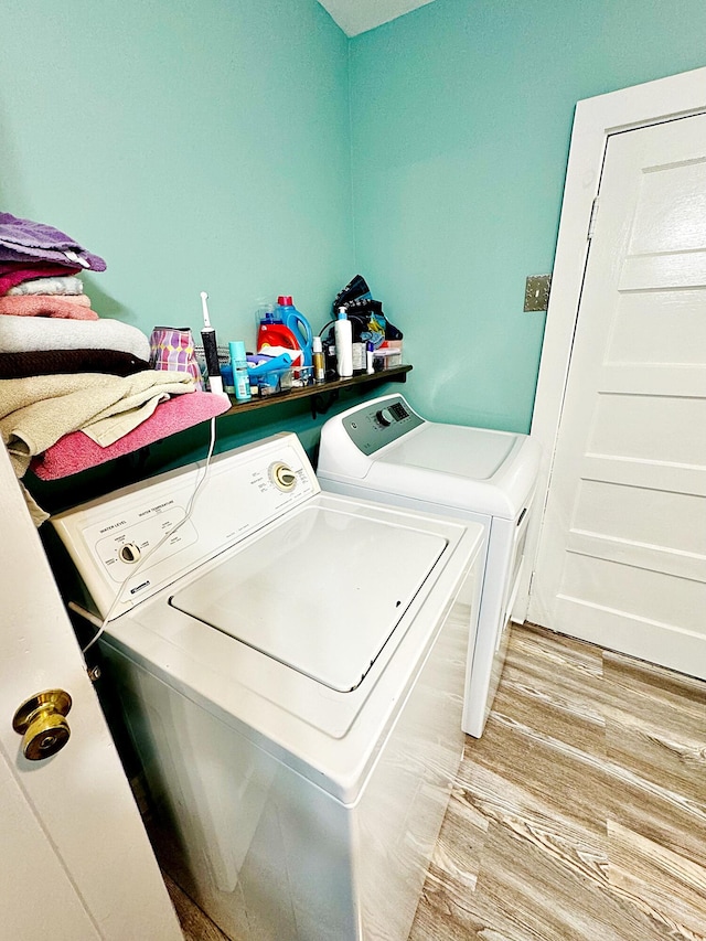 2 High St, Machias, ME 04654 - washroom with washer and dryer and light wood-style floors