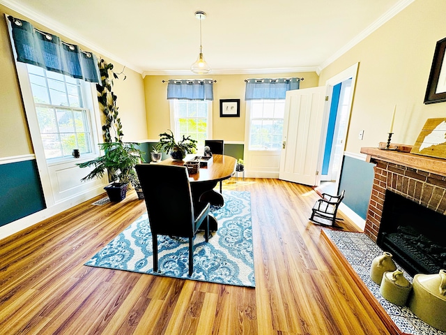 2 High St, Machias, ME 04654 - dining space with ornamental molding, wood finished floors, plenty of natural light, and baseboards