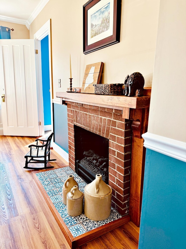 2 High St, Machias, ME 04654 - living area featuring crown molding, a brick fireplace, and wood finished floors