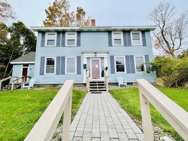 2 High St, Machias, ME 04654 - view of front facade featuring a chimney and a front yard