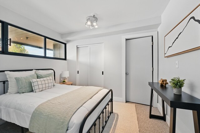 3027 Main St Unit 3027, Carrabassett Valley, ME 04947 - bedroom featuring light colored carpet and two closets