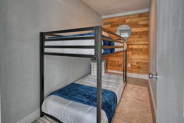 3027 Main St Unit 3027, Carrabassett Valley, ME 04947 - bedroom featuring wood walls and baseboards