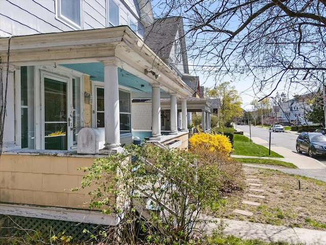 view of home's exterior featuring covered porch