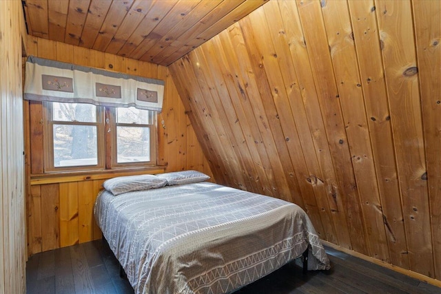 bedroom featuring wooden walls, wood-type flooring, and wood ceiling