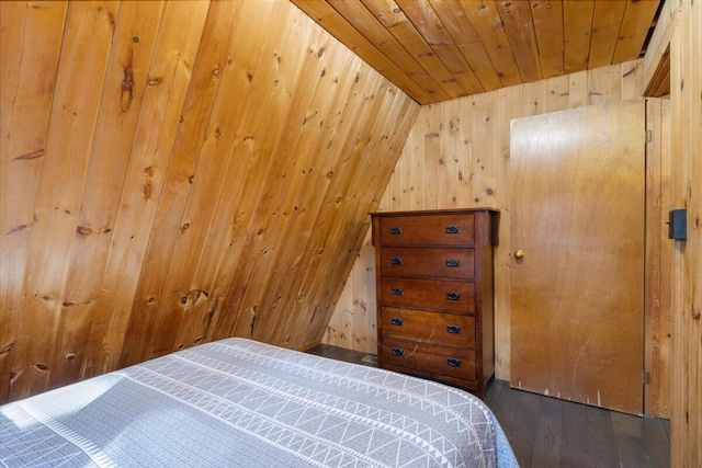 bedroom featuring wood walls, wooden ceiling, and wood finished floors