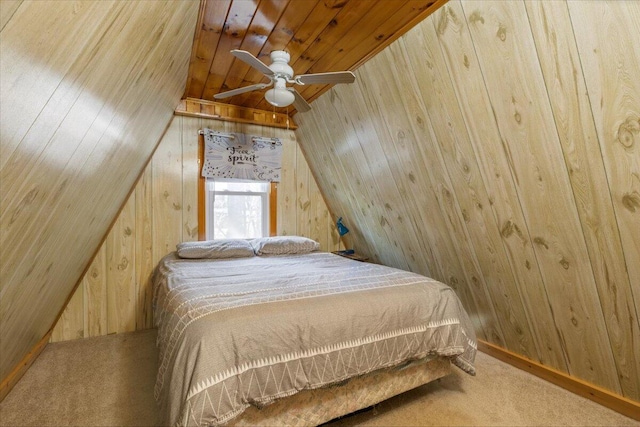 bedroom with carpet floors, wooden walls, wooden ceiling, and lofted ceiling