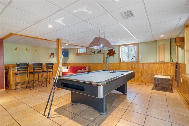 game room with wainscoting, billiards table, wood walls, tile patterned flooring, and a drop ceiling