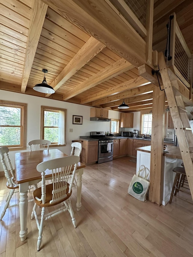 1157 Back Cv, Waldoboro, ME 04572 - dining space featuring beamed ceiling, plenty of natural light, wooden ceiling, and light wood-type flooring