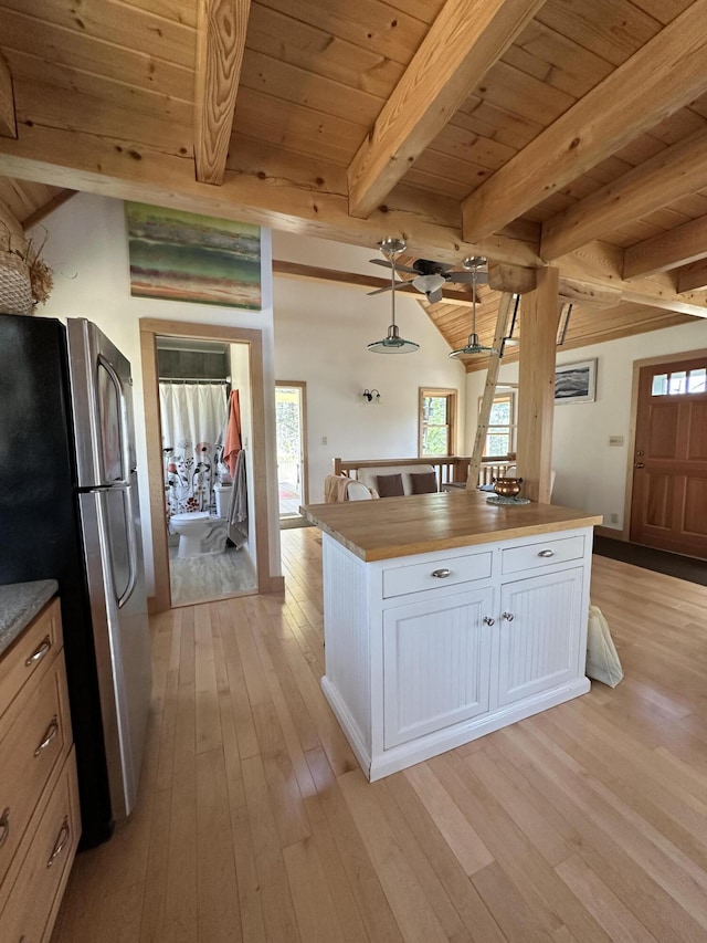 1157 Back Cv, Waldoboro, ME 04572 - kitchen featuring freestanding refrigerator, wooden ceiling, light wood finished floors, white cabinetry, and butcher block countertops