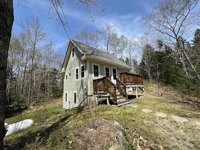 1157 Back Cv, Waldoboro, ME 04572 - view of front facade with a wooden deck and a shingled roof