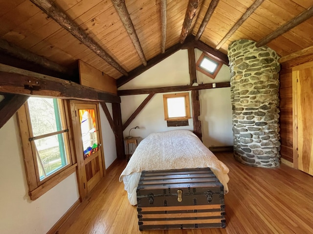 bedroom with wooden ceiling, hardwood / wood-style flooring, and baseboards
