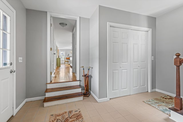 7 Canterbury Pines Dr, Gorham, ME 04038 - entrance foyer with tile patterned flooring, baseboards, and stairs