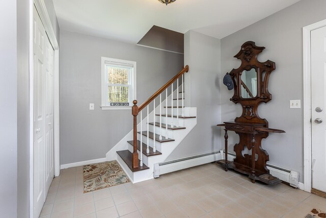 7 Canterbury Pines Dr, Gorham, ME 04038 - foyer entrance with a baseboard heating unit, stairs, baseboards, and tile patterned flooring