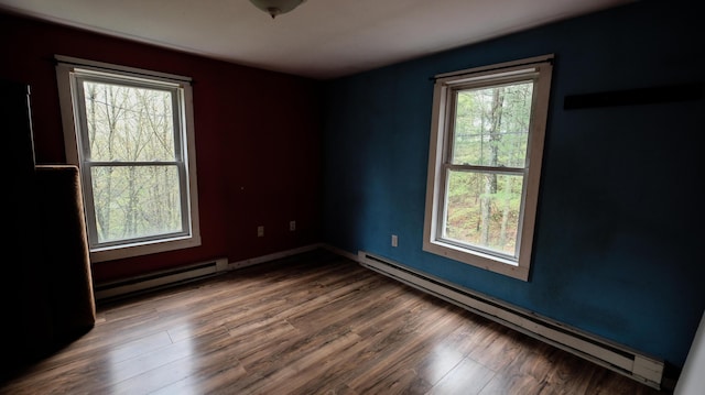1 Nichols St, Bath, ME 04530 - spare room with baseboard heating, wood finished floors, and baseboards