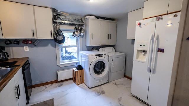 1 Nichols St, Bath, ME 04530 - laundry area with radiator heating unit, independent washer and dryer, and baseboards