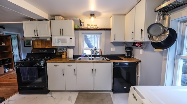 1 Nichols St, Bath, ME 04530 - kitchen with black appliances, a sink, white cabinets, and under cabinet range hood