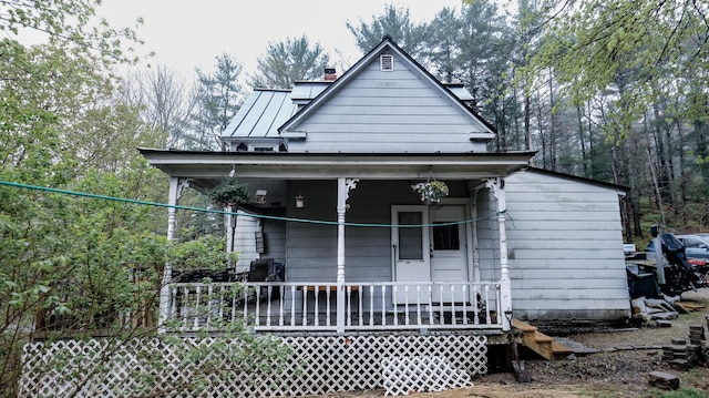 1 Nichols St, Bath, ME 04530 - shotgun-style home with a porch and a chimney