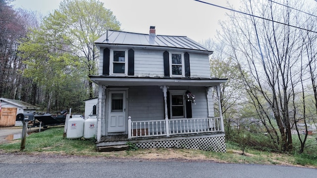 1 Nichols St, Bath, ME 04530 - view of front of property with covered porch, a standing seam roof, a chimney, and metal roof