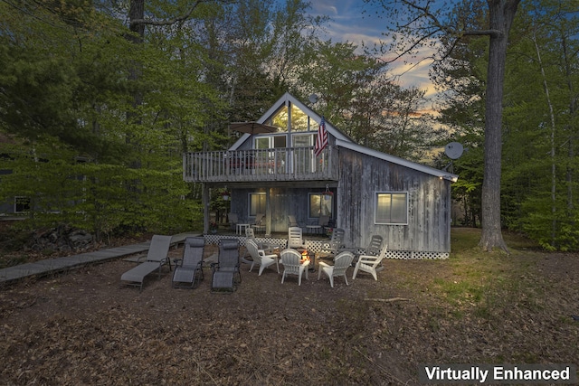 489 Leisure Ln, Frye Island, ME 04071 - back of property featuring a wooden deck and an outdoor fire pit