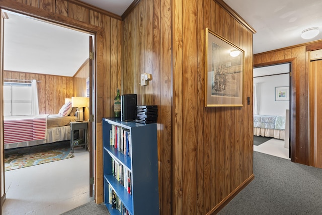 489 Leisure Ln, Frye Island, ME 04071 - hall with wood walls, carpet floors, and ornamental molding