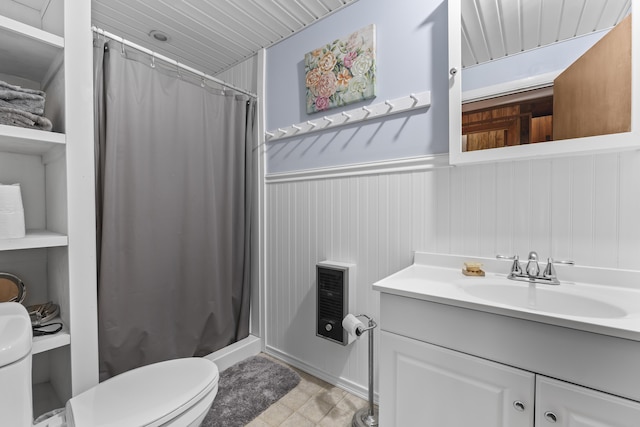 489 Leisure Ln, Frye Island, ME 04071 - bathroom featuring toilet, a shower stall, vanity, and wainscoting