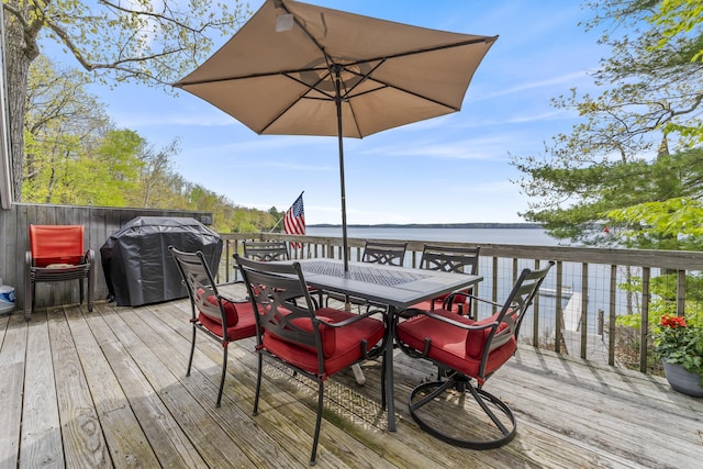 489 Leisure Ln, Frye Island, ME 04071 - deck featuring outdoor dining area, a grill, and a water view