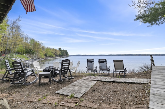 489 Leisure Ln, Frye Island, ME 04071 - dock area featuring a water view and an outdoor fire pit