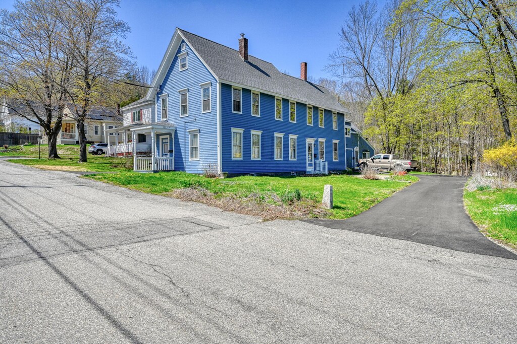 7 Page St, Hallowell, ME 04347 - view of home's exterior with a chimney, a lawn, and a shingled roof