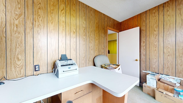 office with wooden walls and light carpet